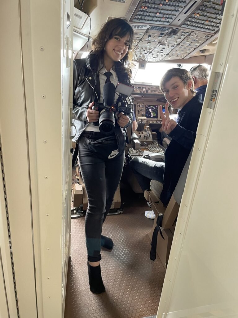 McKenzie filming inside a private jet cabin